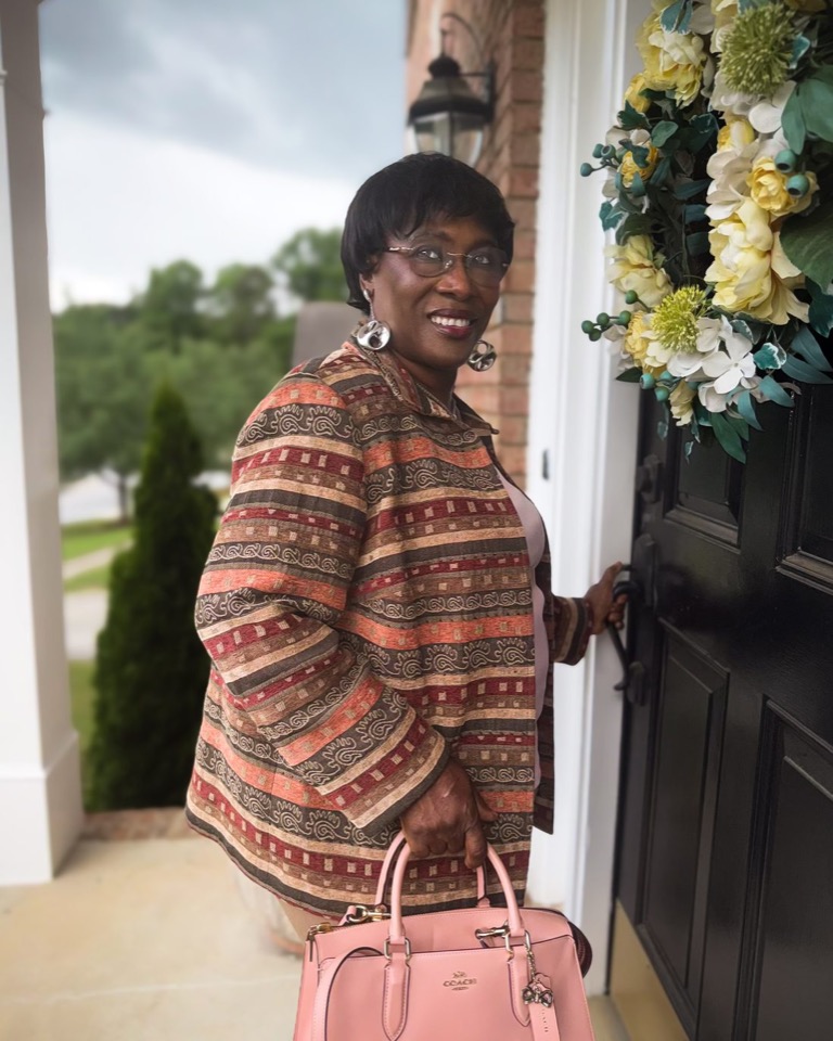 Dalenè SiDone welcoming a child at the front door