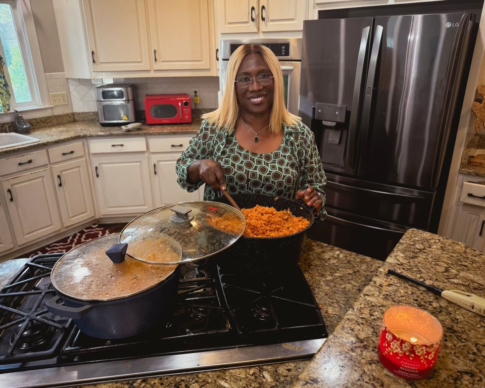 Dalenè SiDone cooking jollof rice on the stove