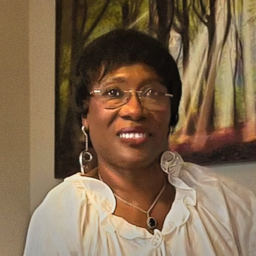 Dalenè SiDone, founder of TammiVille, smiling in a cream blouse
